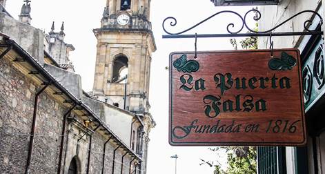 Descripción: http://i.ngenespanol.com/dam/traveler/gastronomia/16/03/2/la-puerta-falsa.jpg.imgw.1280.1280.jpeg